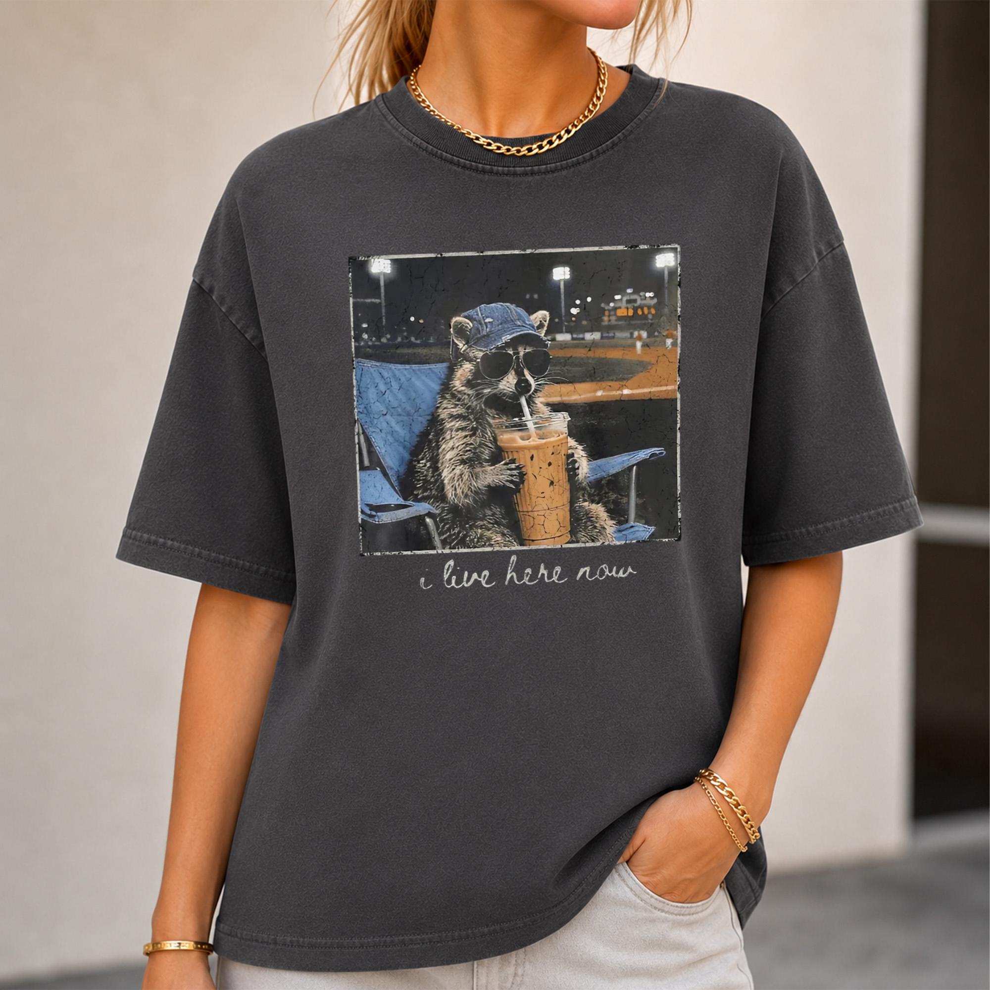 Racoon Ballpark I Live Here Now Meme T-Shirt Funny Raccoon Drinking Iced Coffee Cute Baseball Sport T-Shirt Retro Game Day Graphic Shirt