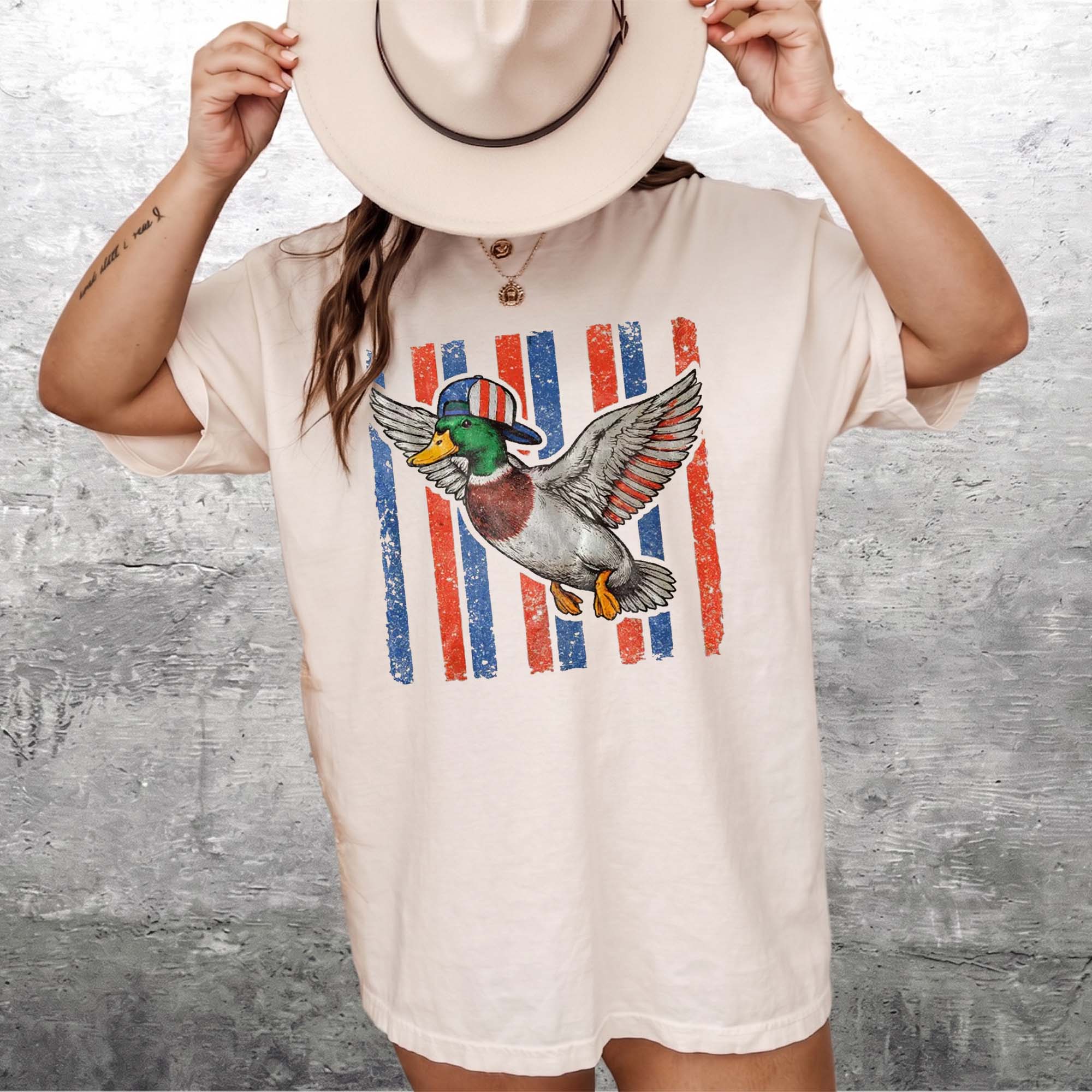 Flying Mallard Duck Patriotic 4th Of July Graphic T-Shirt Unisex Men Women Retro Southern Western Aesthetic Cream Cotton Summer Independence Day Waterfowl Hunting Tee Apparel Vintage Usa American Flag Country Outdoors Casual Top