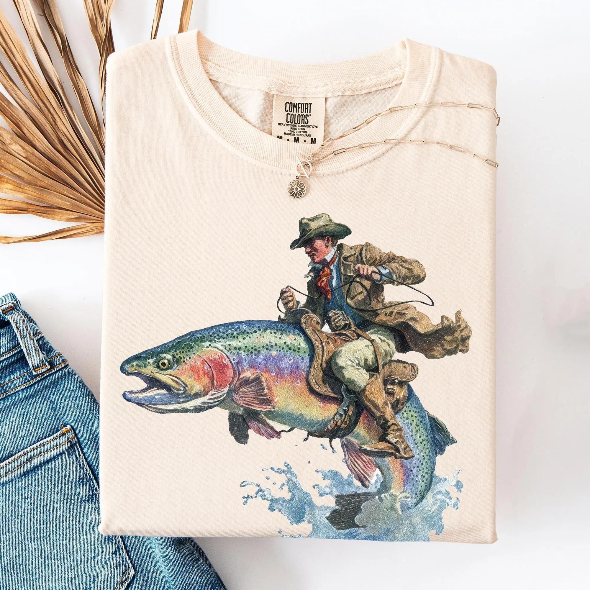 Vintage Western Cowboy Riding Rainbow Trout T-Shirt Unisex Men Women Retro Country Outdoors Aesthetic Cream Beige Cotton Comfort Graphic Tee Short Sleeve Cowboy Fishing Club Rodeo Humorous Novelty Fly Fisherman Top Gift For Father'S Day